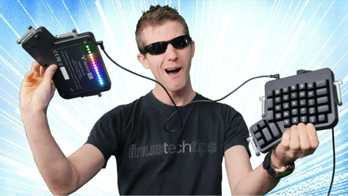 Linus from Linus Tech Tips raising an Ergodox EZ